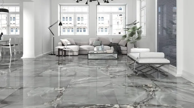 Modern living room with gray marble-look flooring, a sectional sofa, and a chaise lounge.