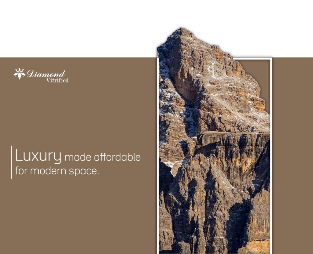 Diamond Vitrified logo with text "Luxury made affordable for modern space" beside a rugged, snow-dusted mountain peak.