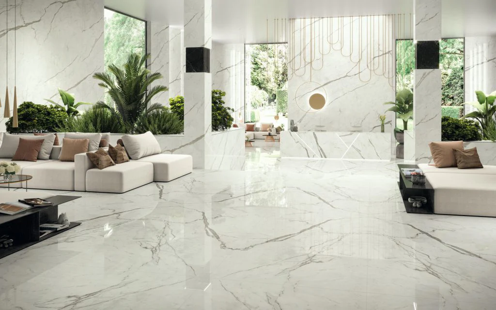 Stylishly designed interior space with white marble flooring, large windows, and comfortable seating areas.